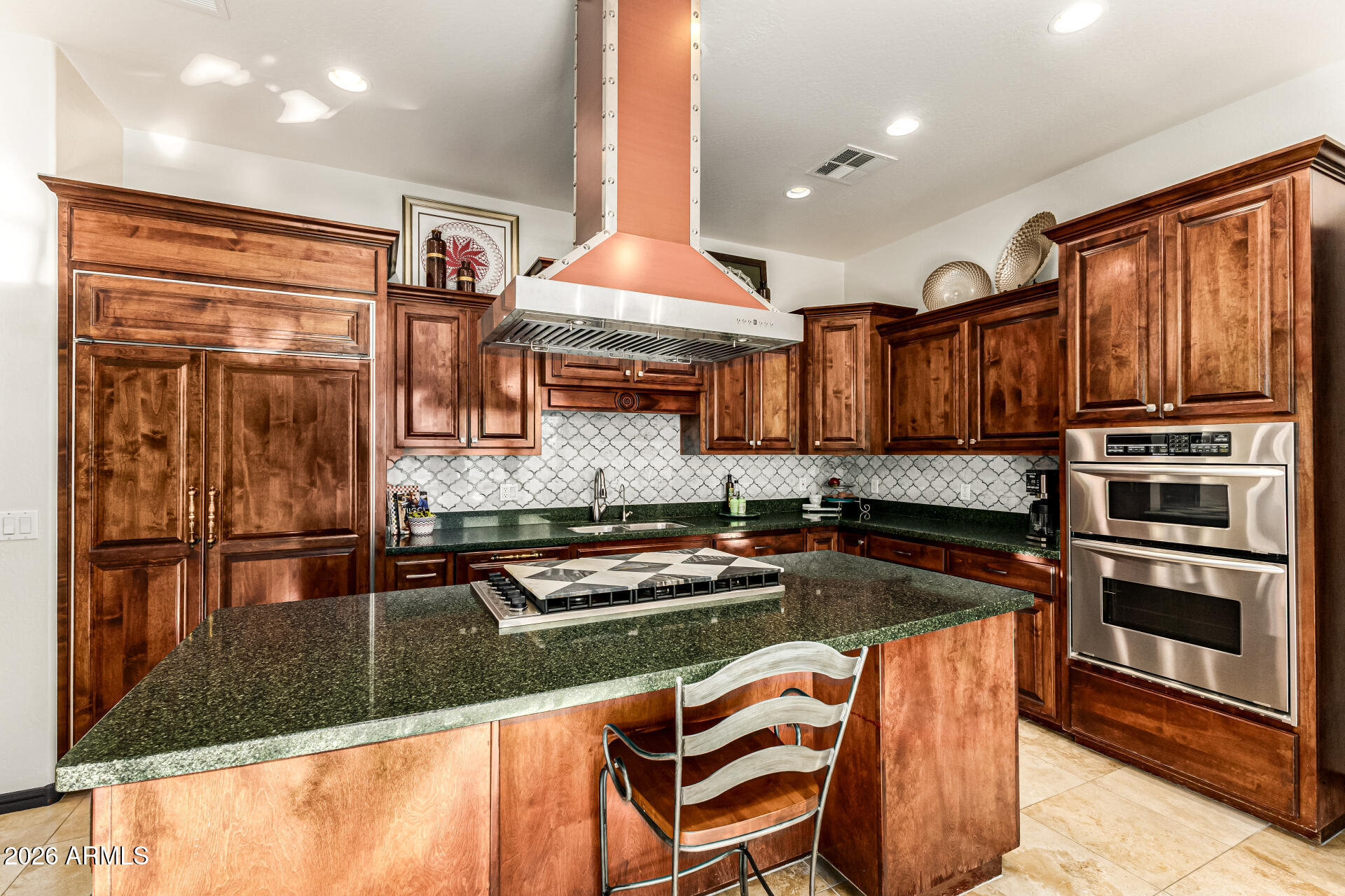 3418 East Pyrenees Pass Phoenix, AZ 85018 - Photo 15 of 46 a kitchen with stainless steel appliances granite countertop a stove top oven a sink and a microwave