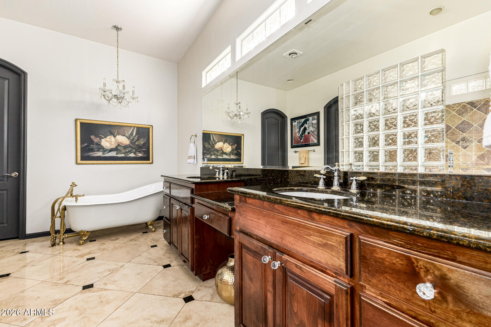 3418 East Pyrenees Pass Phoenix, AZ 85018 - Photo 20 of 46 a spacious bathroom with a bathtub a sink and a large mirror