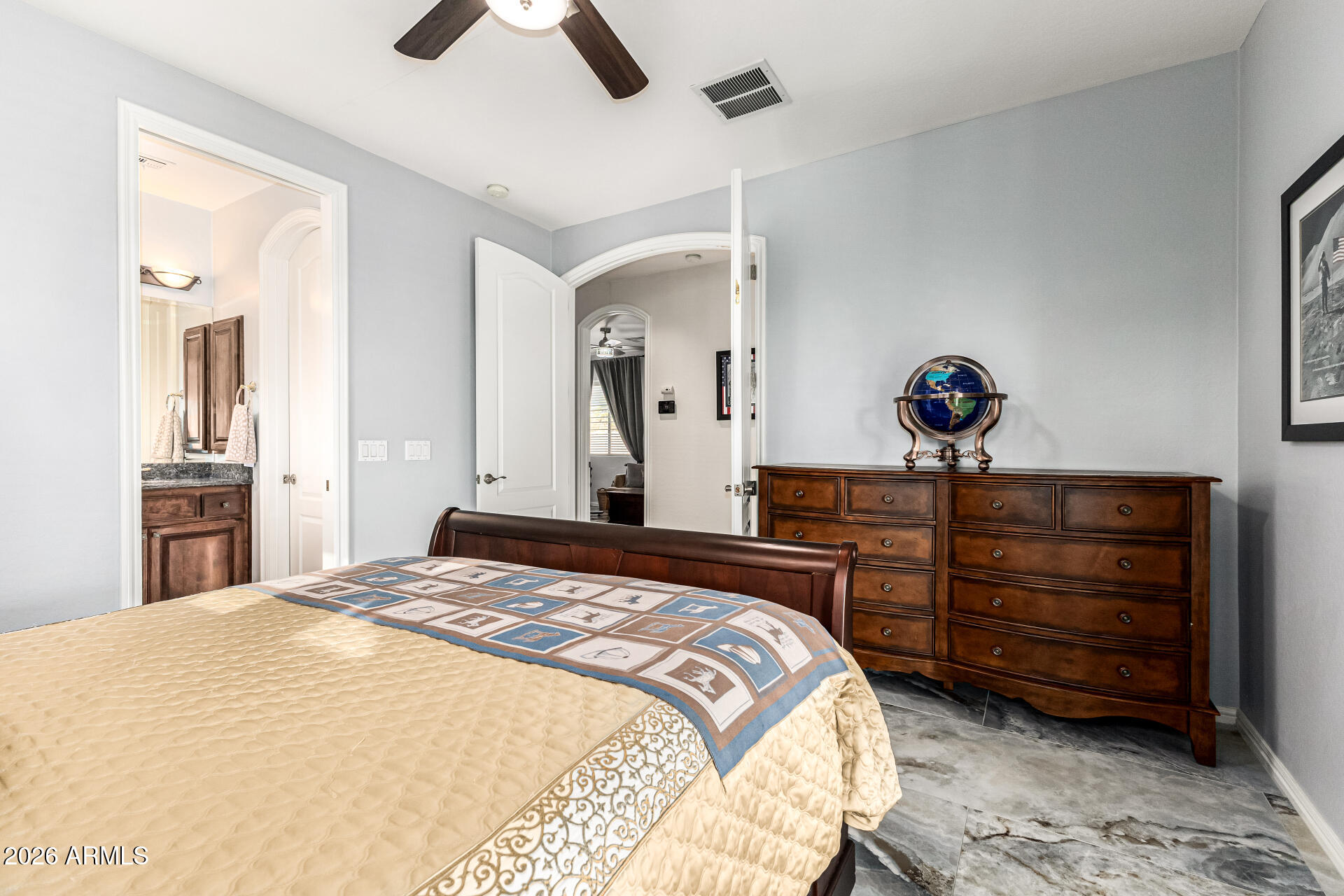 3418 East Pyrenees Pass Phoenix, AZ 85018 - Photo 22 of 46 a bedroom with a bed and a chandelier