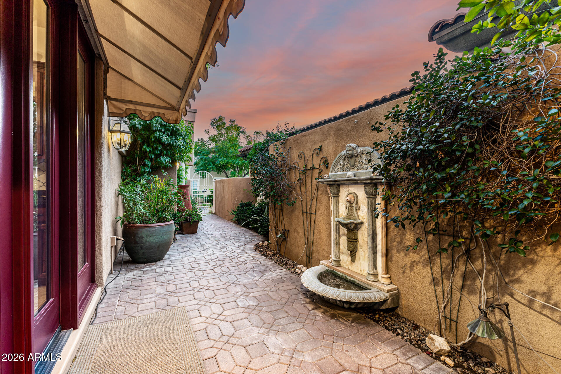 3418 East Pyrenees Pass Phoenix, AZ 85018 - Photo 4 of 46 a front view of a house with a yard