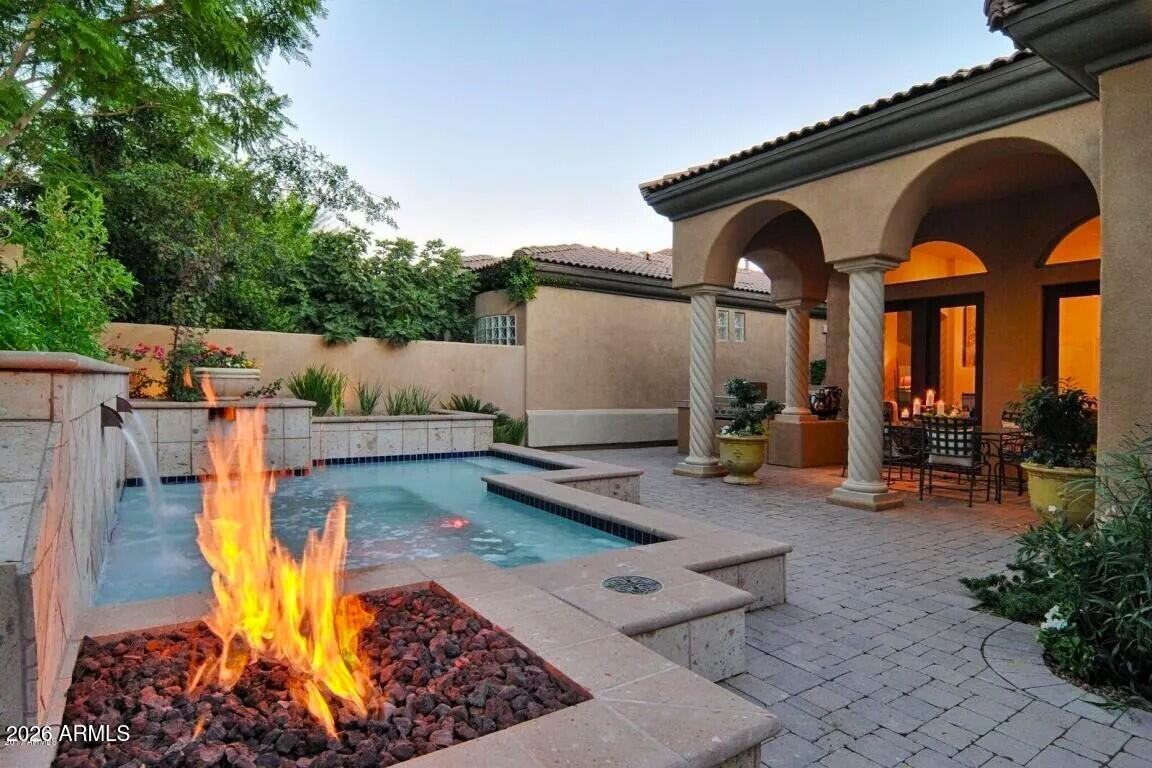 3418 East Pyrenees Pass Phoenix, AZ 85018 - Photo 41 of 46 a view of a house with backyard water view and sitting area