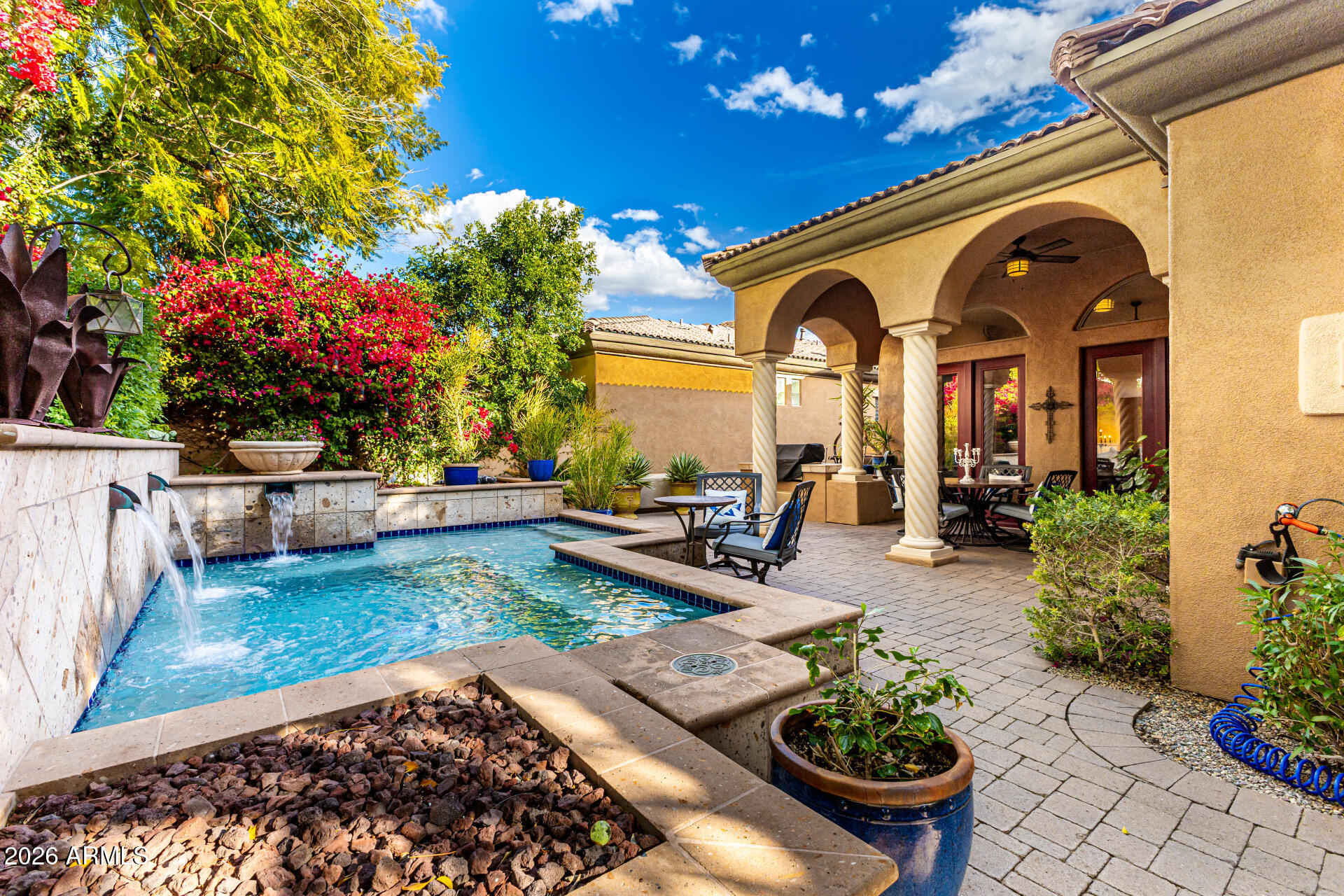 3418 East Pyrenees Pass Phoenix, AZ 85018 - Photo 42 of 46 a view of a garden with patio