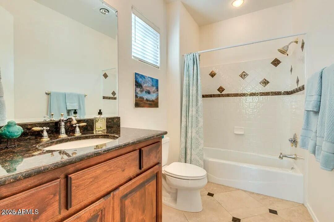 3418 East Pyrenees Pass Phoenix, AZ 85018 - Photo 44 of 46 a bathroom with a granite countertop bathtub sink vanity mirror and toilet