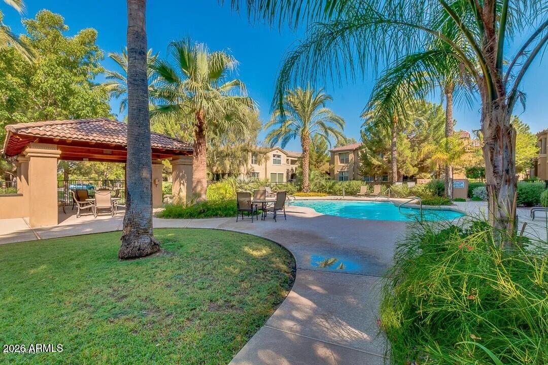 3418 East Pyrenees Pass Phoenix, AZ 85018 - Photo 46 of 46 a backyard of a house with lots of green space
