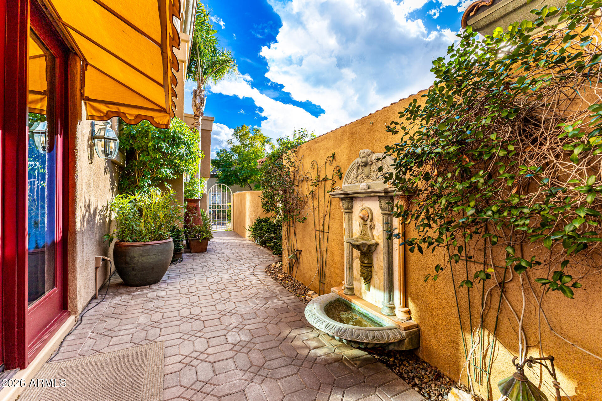 3418 East Pyrenees Pass Phoenix, AZ 85018 - Photo 6 of 46 a view of a back yard with potted plants