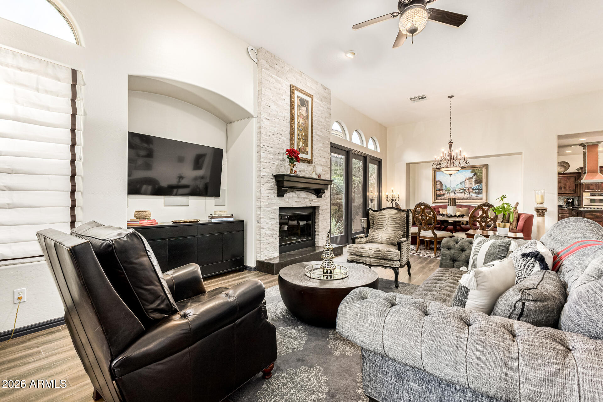3418 East Pyrenees Pass Phoenix, AZ 85018 - Photo 9 of 46 a living room with fireplace furniture and a flat screen tv