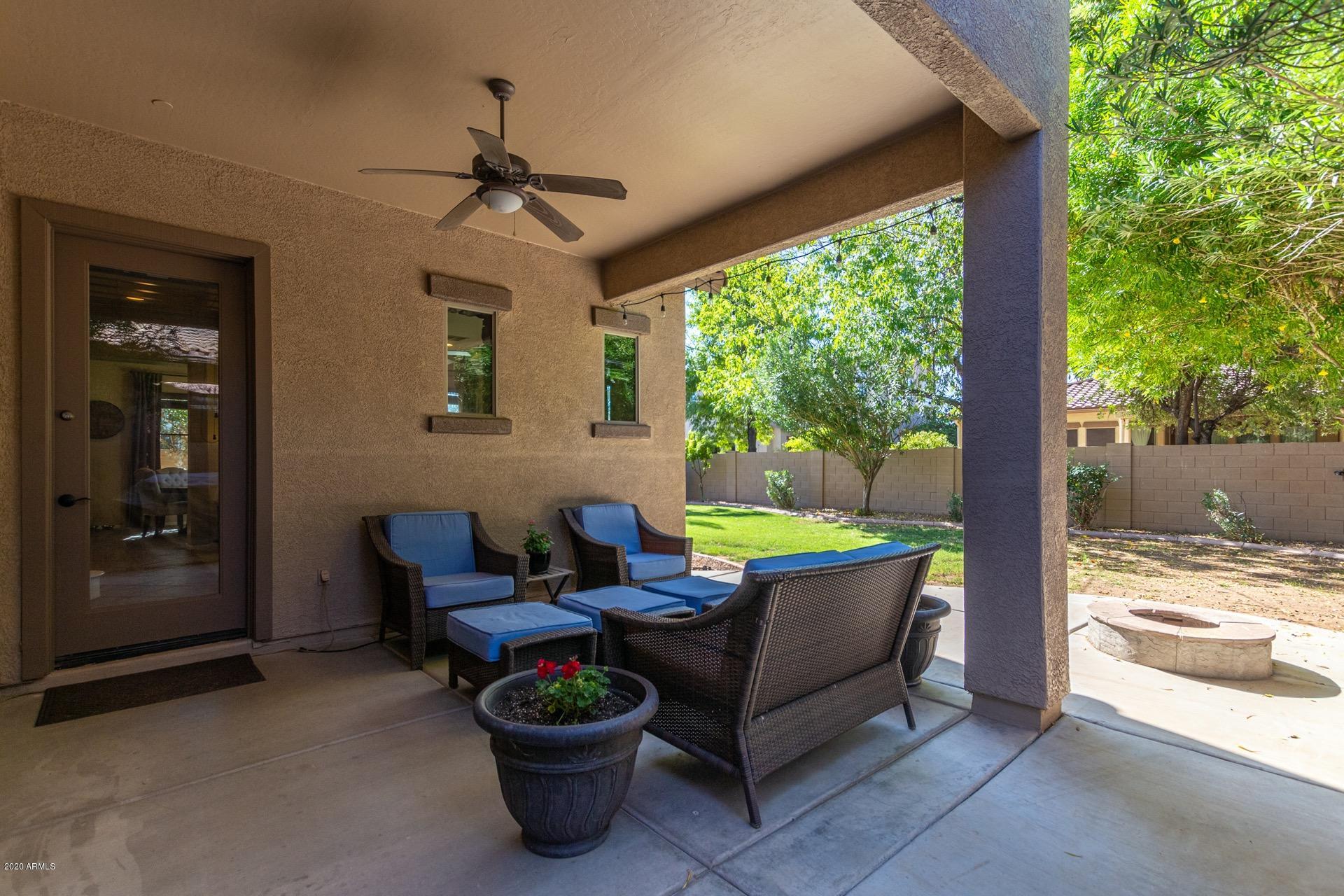 1043 Phelps Street Gilbert, AZ 85295 - Photo 17 of 18 a outdoor space with patio the couches and potted plants