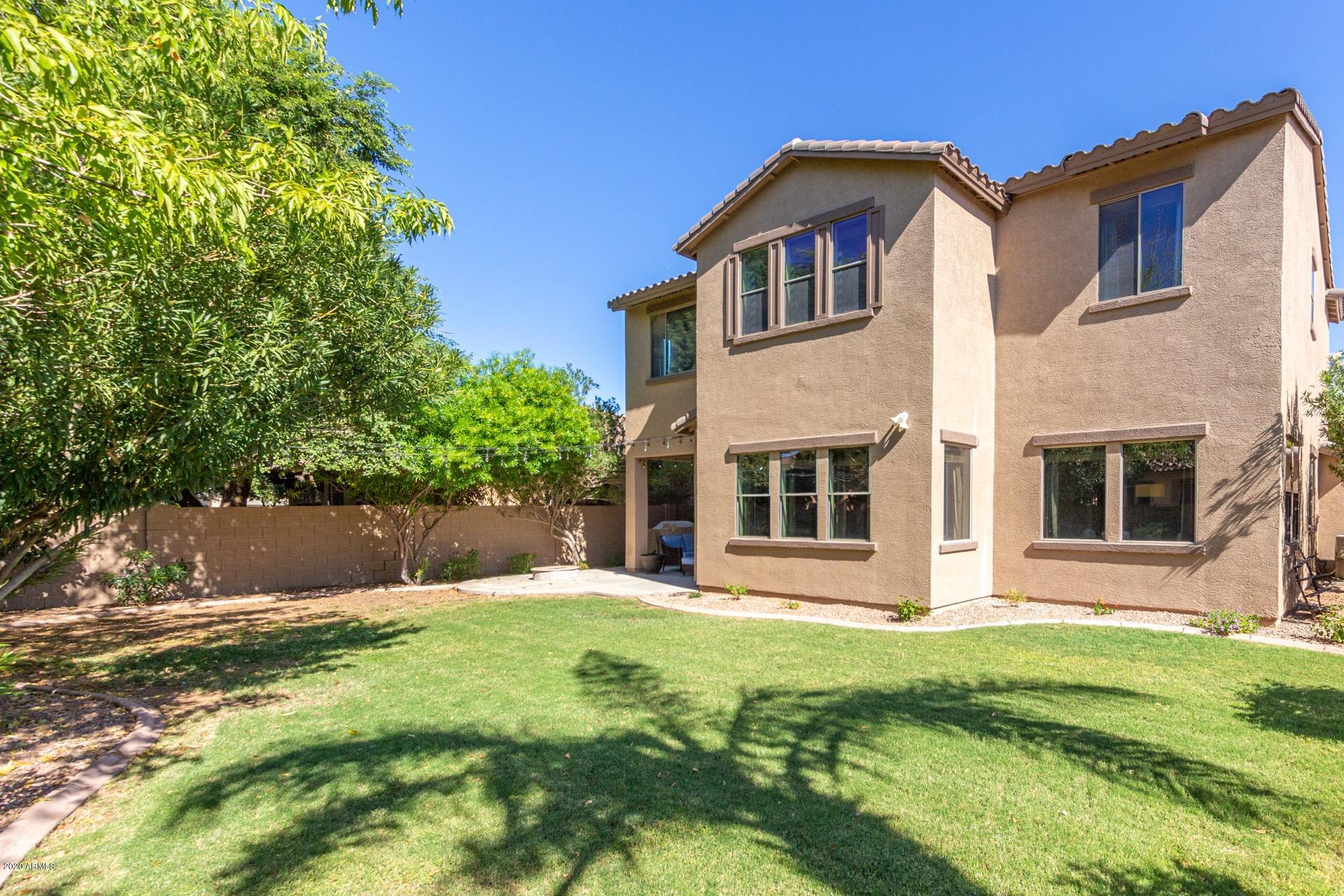 1043 Phelps Street Gilbert, AZ 85295 - Photo 18 of 18 a front view of a house with a yard