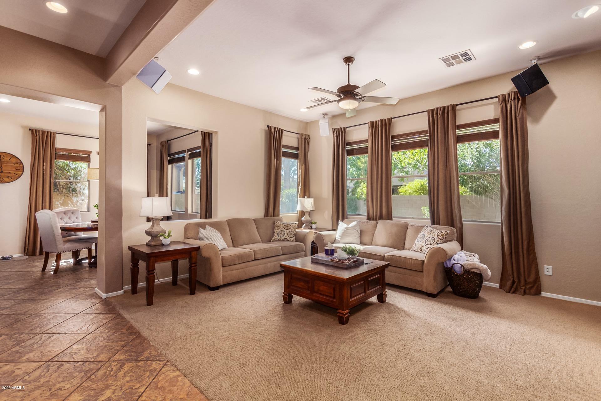 1043 Phelps Street Gilbert, AZ 85295 - Photo 6 of 18 a living room with furniture and a large window