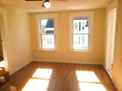 a view of an empty room and window