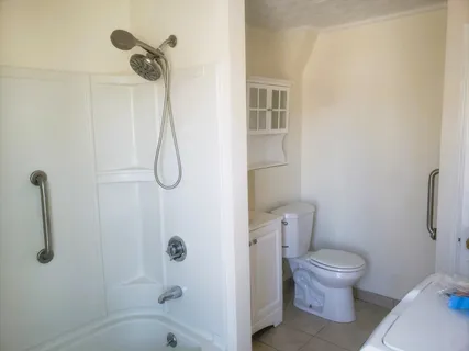 a bathroom with a toilet and shower