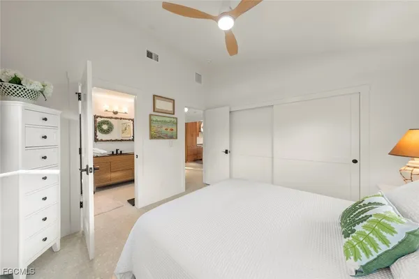 a bedroom with a bed and a walk in closet