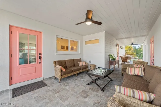 a living room with furniture and a window