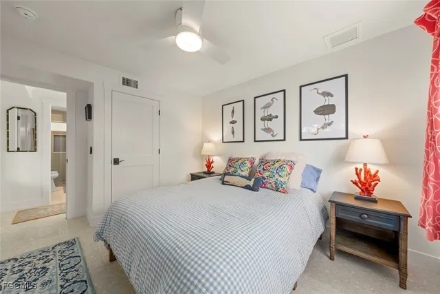 a bedroom with a bed and cabinets