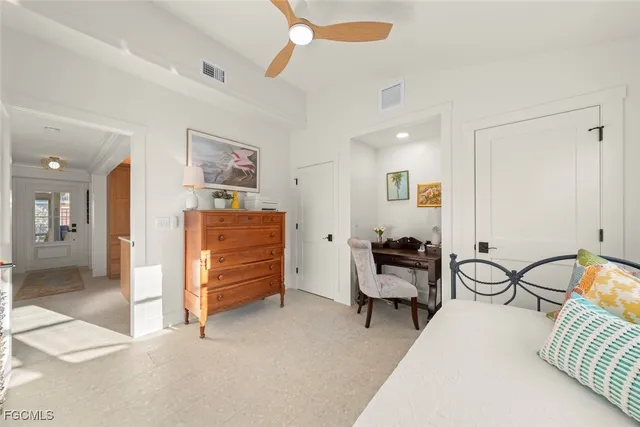 a bedroom with furniture and a chair