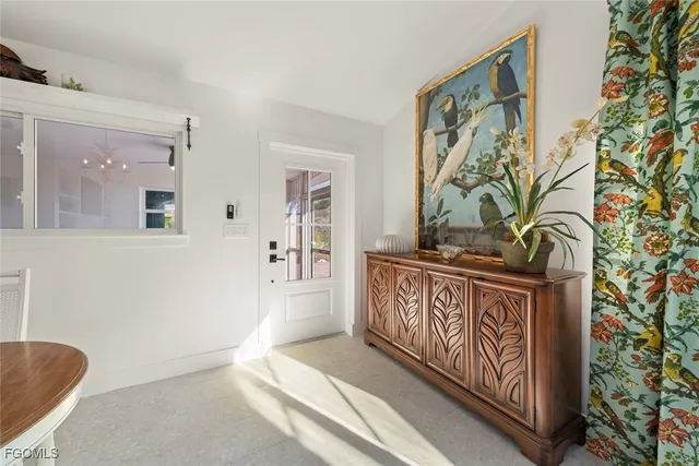 a view of a entryway door with wooden floor