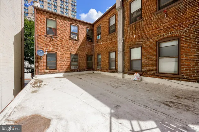 a view of a building with a door and a window