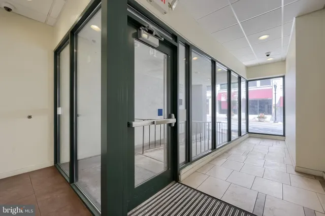 a work room with furniture and a chandelier