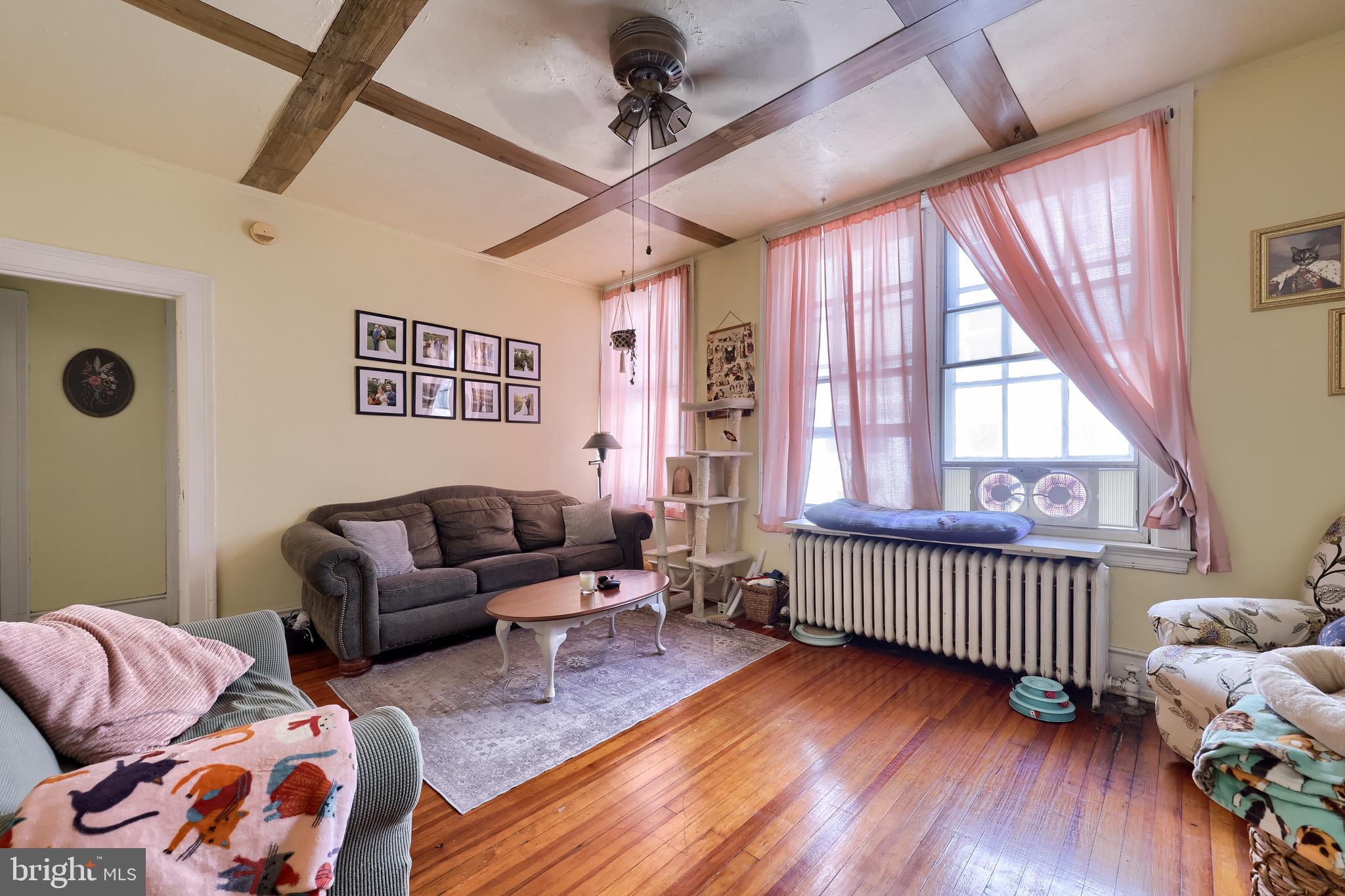 12 South Queen Street Lancaster, PA 17603 - Photo 32 of 58 a bedroom with furniture and a wooden floor