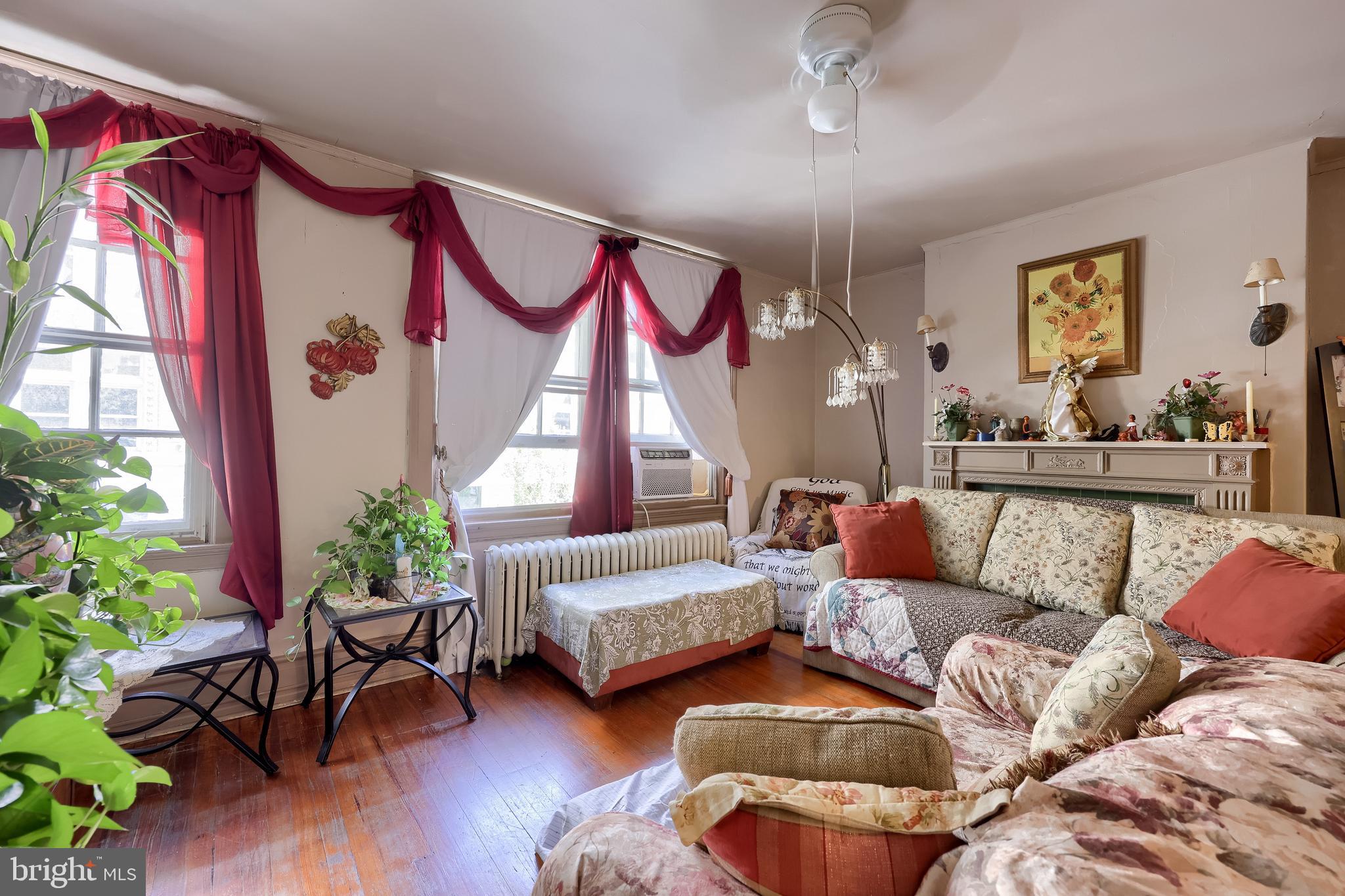12 South Queen Street Lancaster, PA 17603 - Photo 44 of 58 a living room with furniture and a potted plant