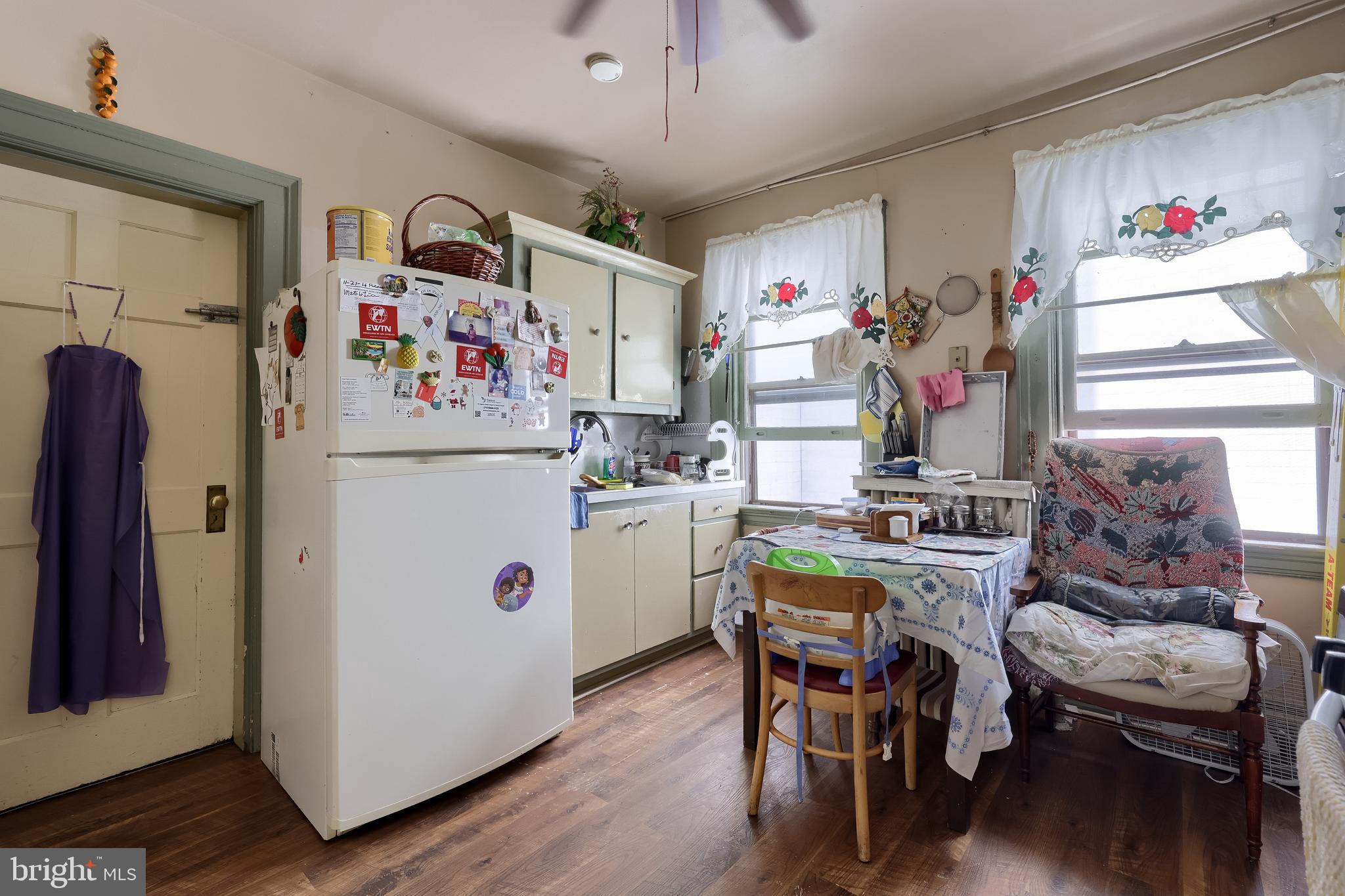 12 South Queen Street Lancaster, PA 17603 - Photo 48 of 58 a utility room with stainless steel appliances lots of white furniture and wooden floor