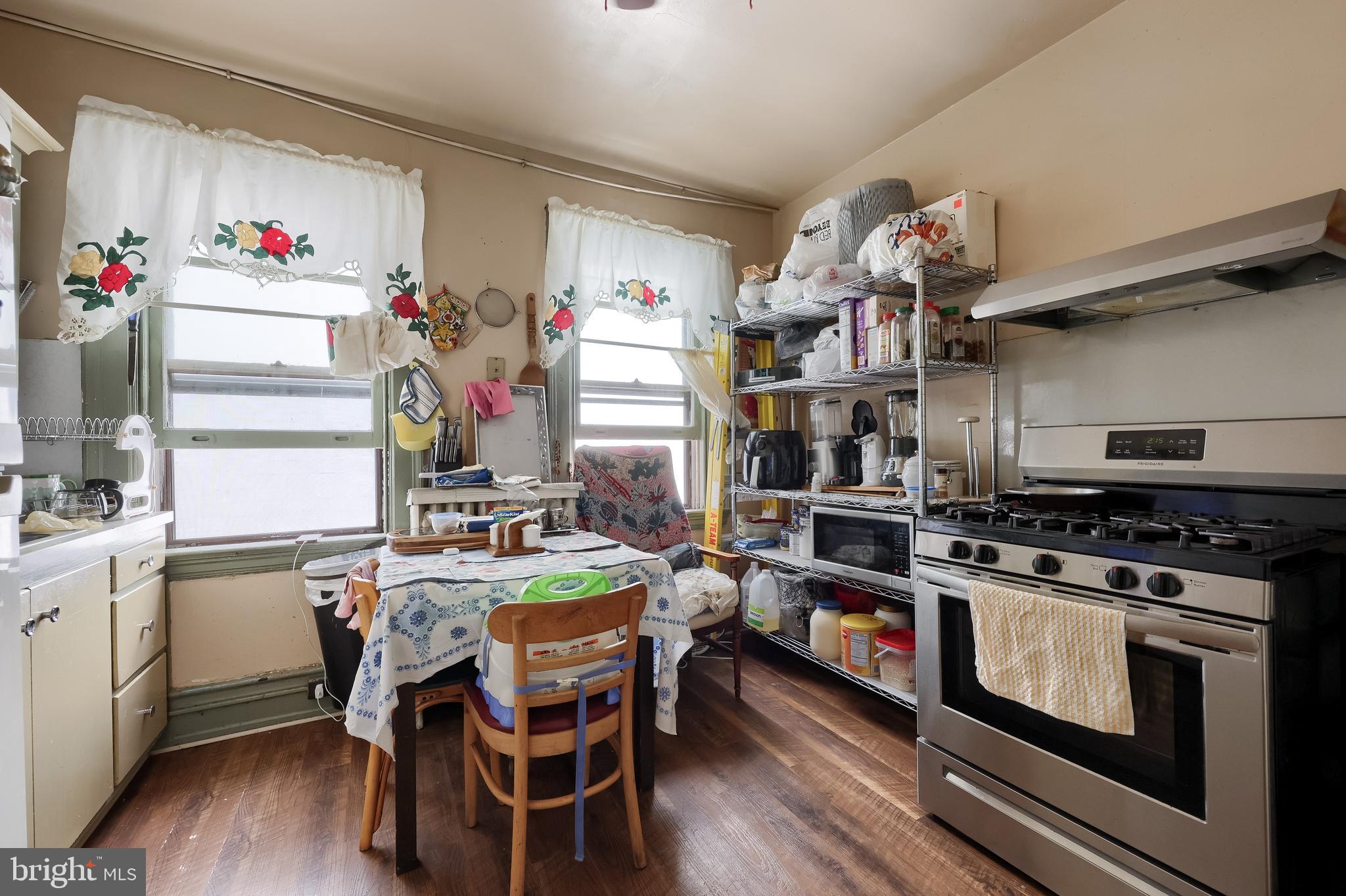 12 South Queen Street Lancaster, PA 17603 - Photo 49 of 58 a kitchen with stove and cabinets