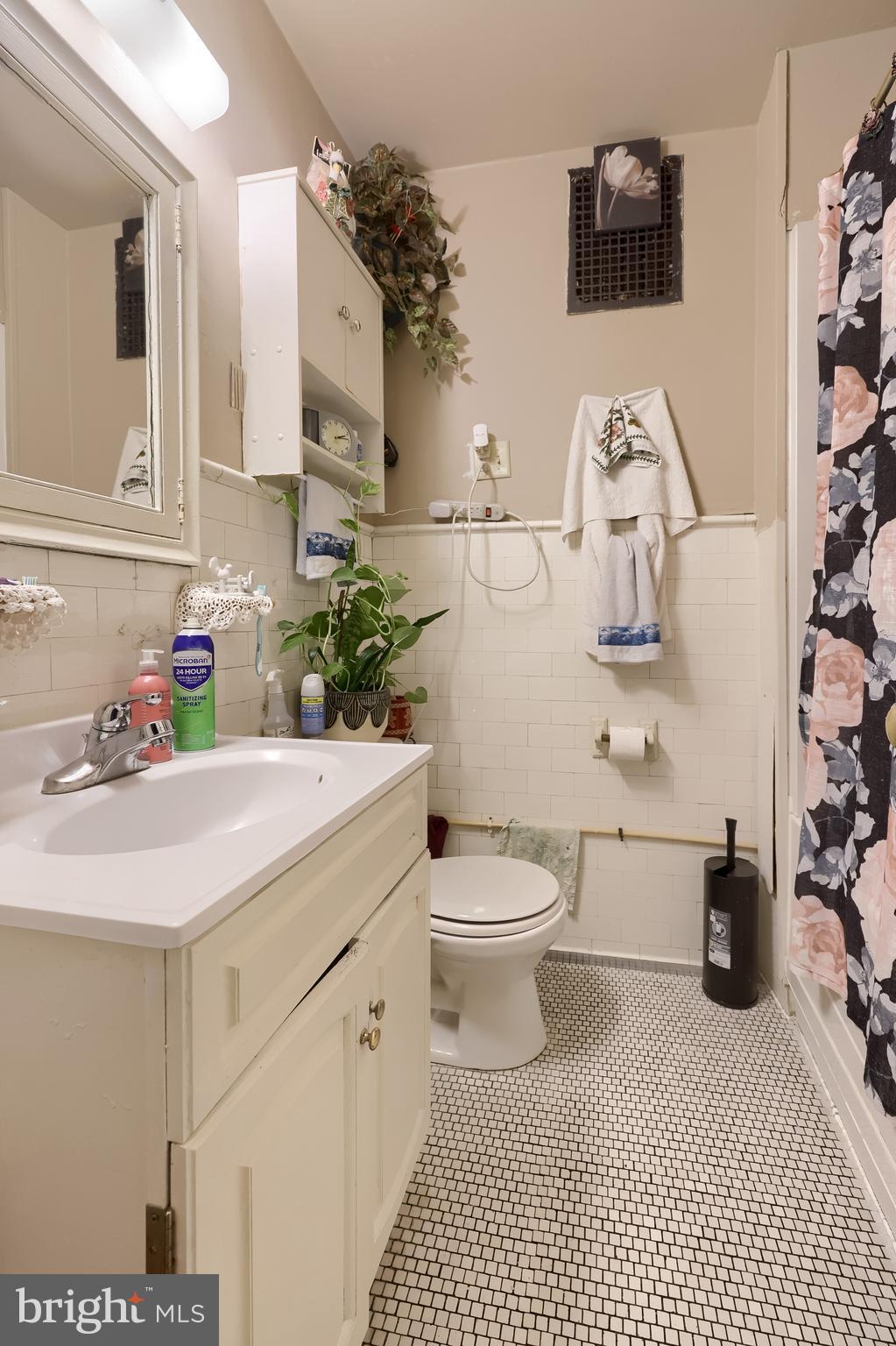 12 South Queen Street Lancaster, PA 17603 - Photo 51 of 58 a bathroom with a sink a toilet and a mirror