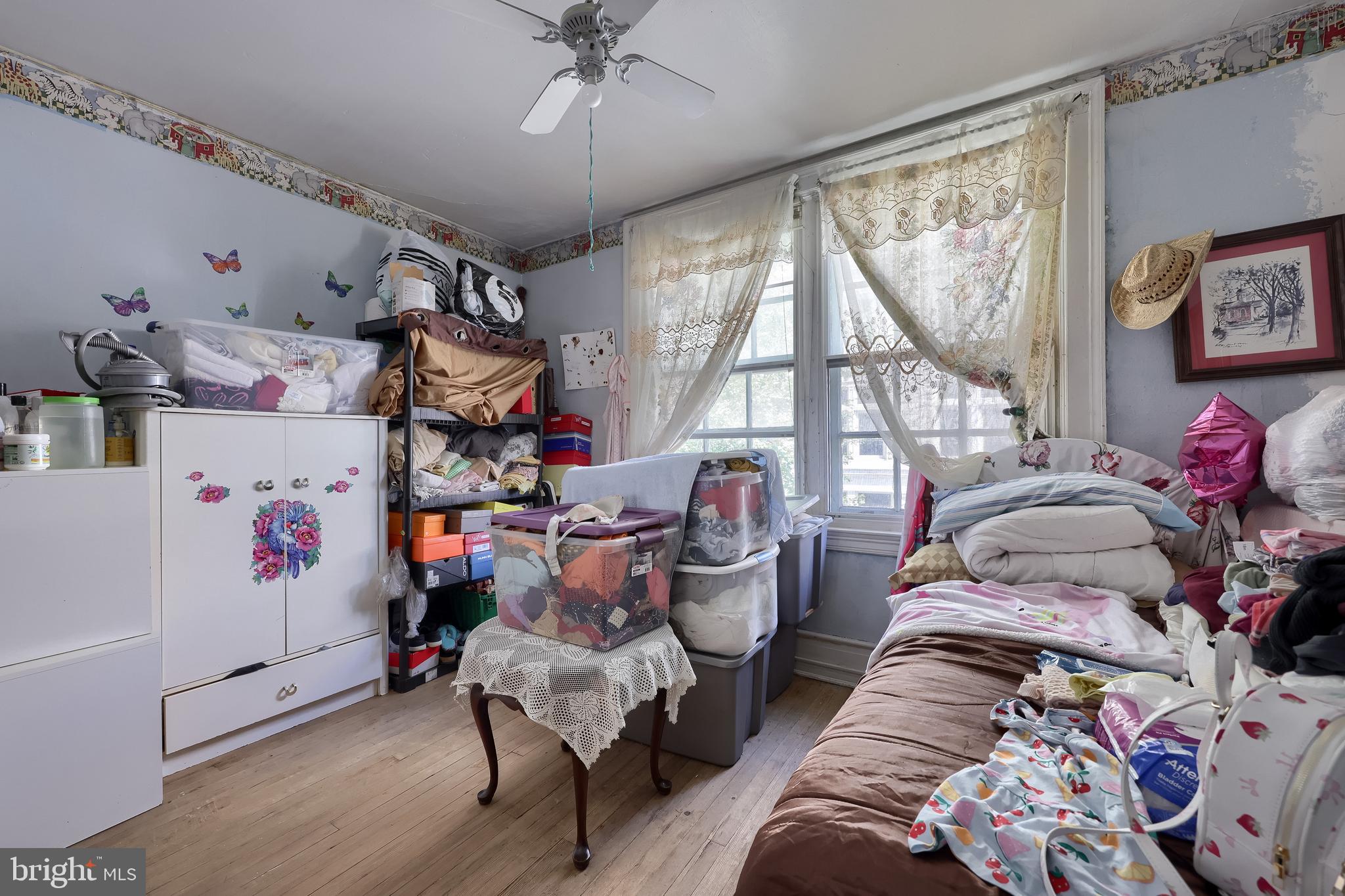 12 South Queen Street Lancaster, PA 17603 - Photo 52 of 58 a bed room with a bed and a chandelier