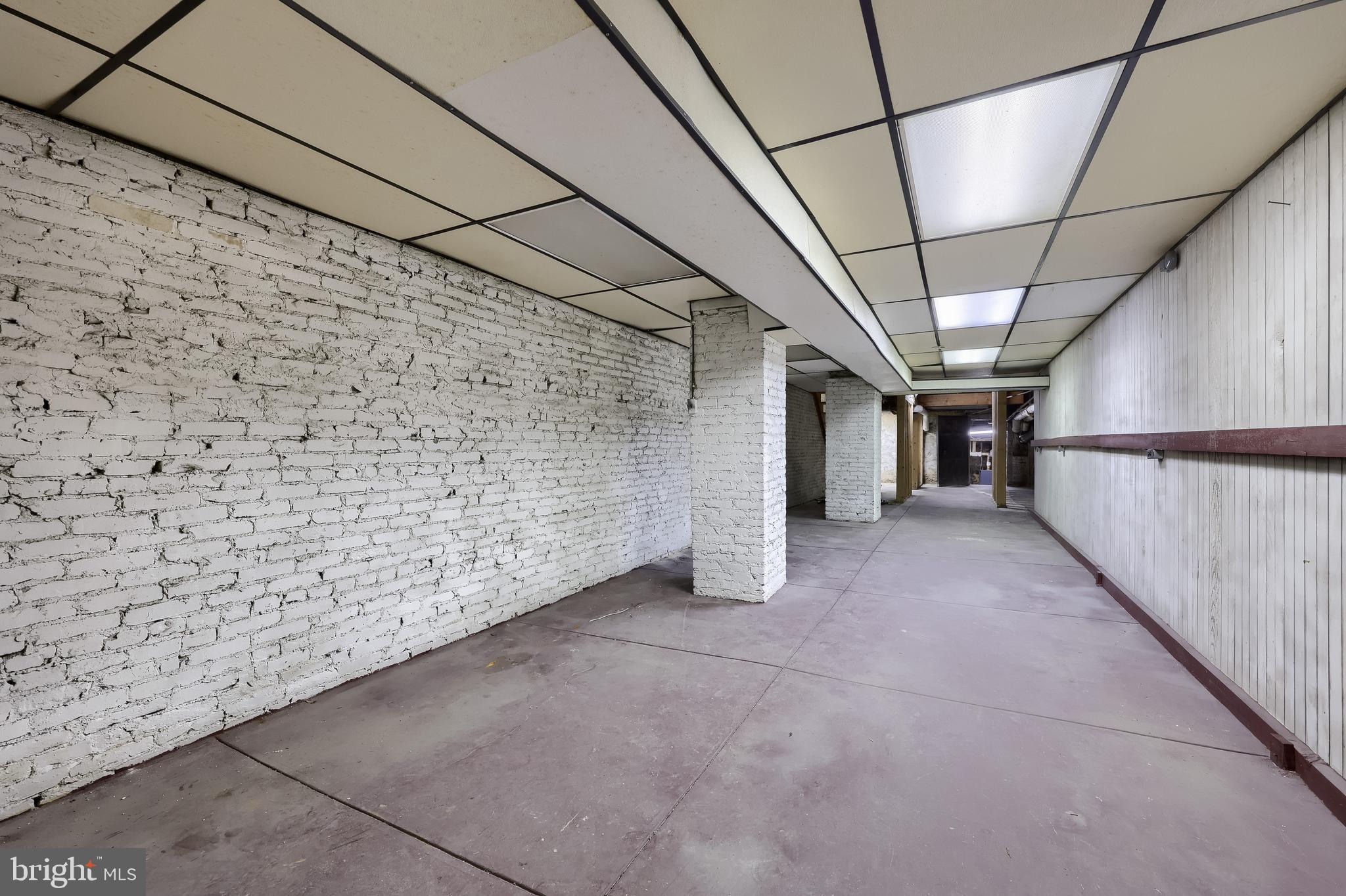 12 South Queen Street Lancaster, PA 17603 - Photo 57 of 58 a view of a empty room with a brick wall