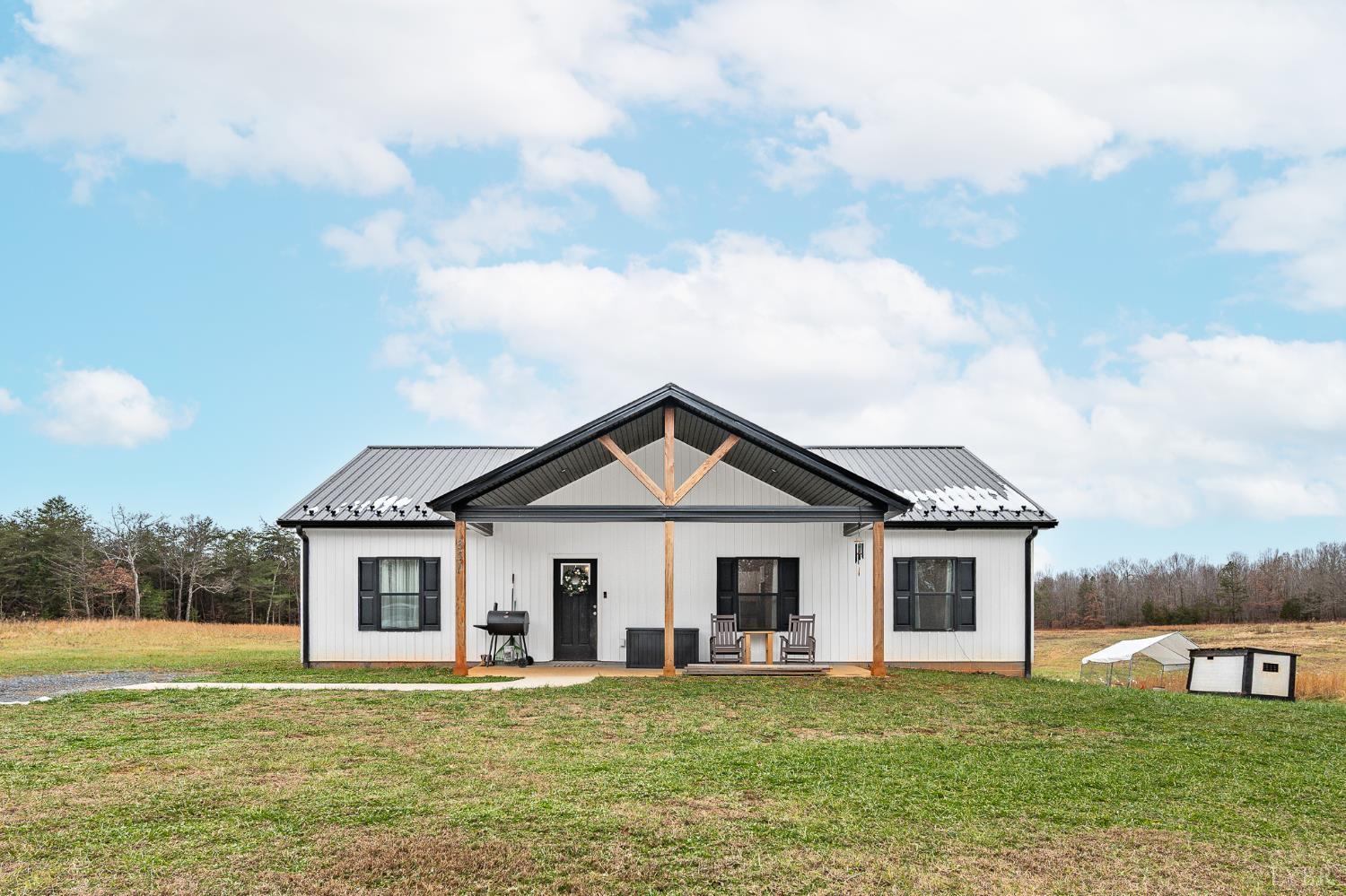 351 Down Creek Road Brookneal, VA 24528 - Photo 1 of 42 a front view of a house with a garden