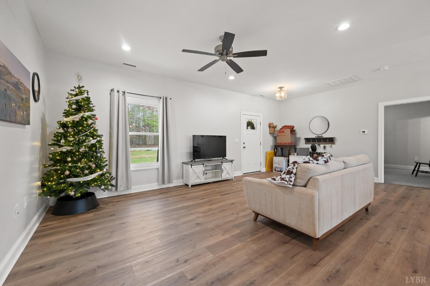 351 Down Creek Road Brookneal, VA 24528 - Photo 13 of 42 a living room with furniture and a flat screen tv