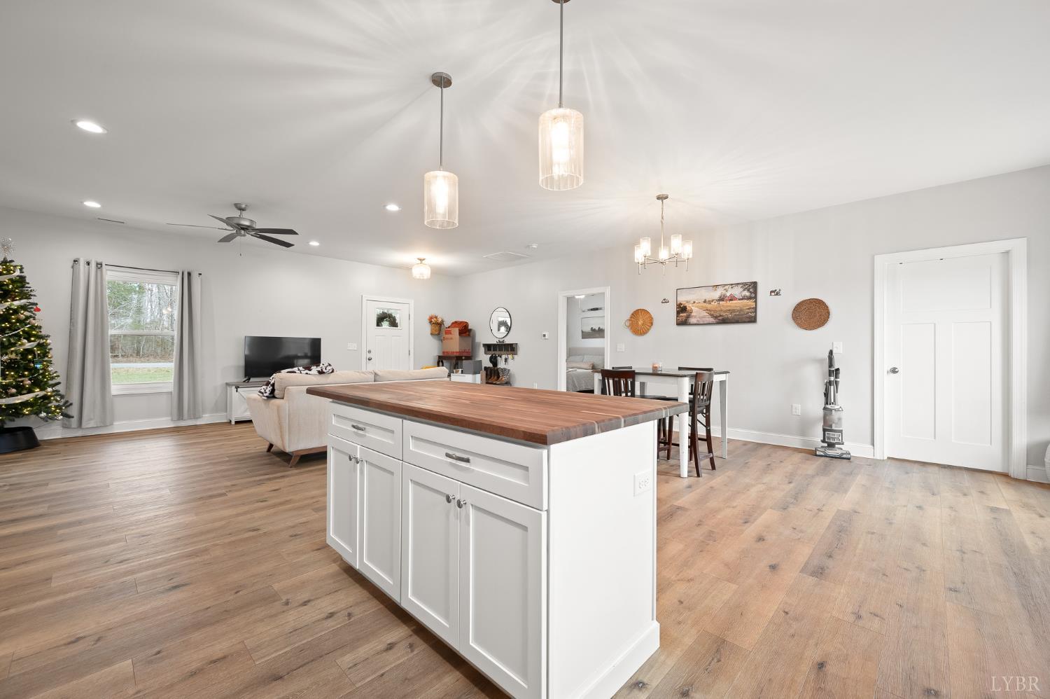 351 Down Creek Road Brookneal, VA 24528 - Photo 19 of 42 a view of living room with kitchen island stainless steel appliances wooden floor and living room view