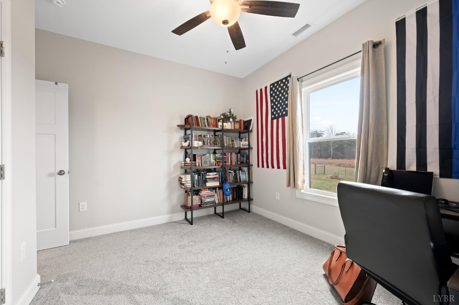 351 Down Creek Road Brookneal, VA 24528 - Photo 23 of 42 a view of a livingroom with a chair and a large window
