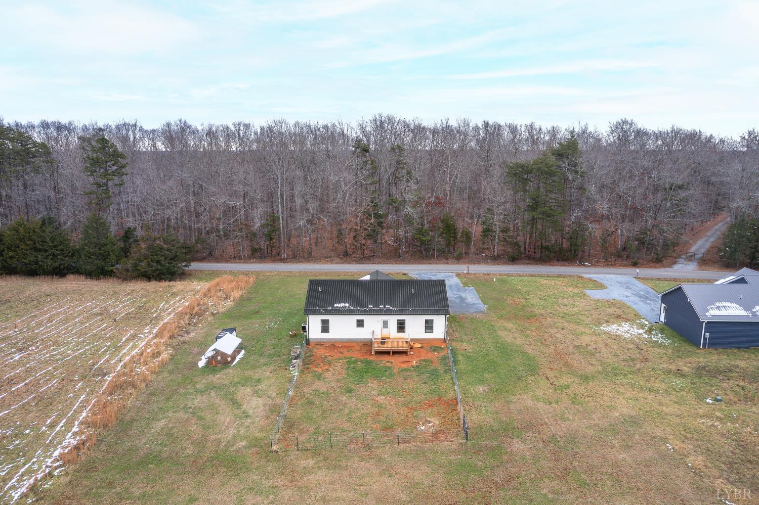 351 Down Creek Road Brookneal, VA 24528 - Photo 37 of 42 a view of a swimming pool with trees in the background