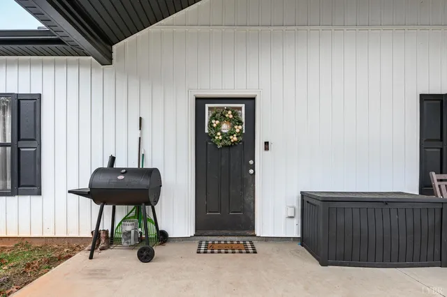 a view of a livingroom with furniture and front door