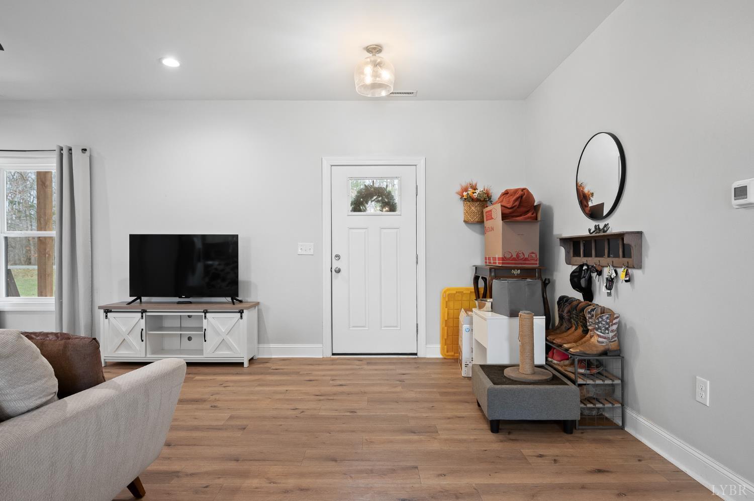 351 Down Creek Road Brookneal, VA 24528 - Photo 9 of 42 a living room with furniture and a flat screen tv