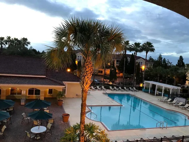 a front view of a house with outdoor seating
