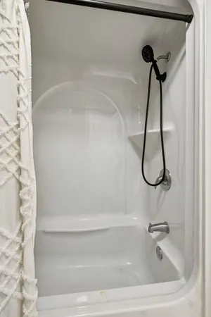 a bathroom with a bath tub