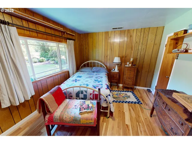 a view of a dining room with furniture and window