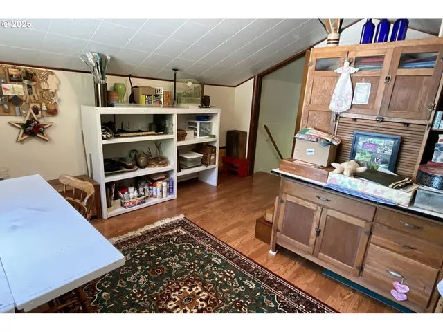 a living room with furniture and a book shelf