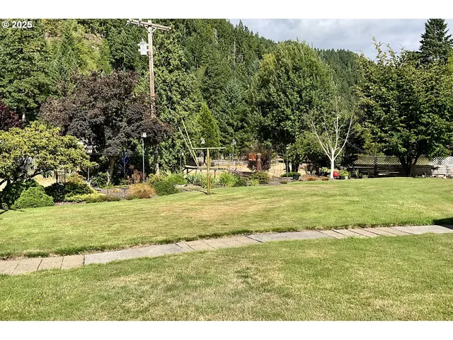 a view of a house with a big yard