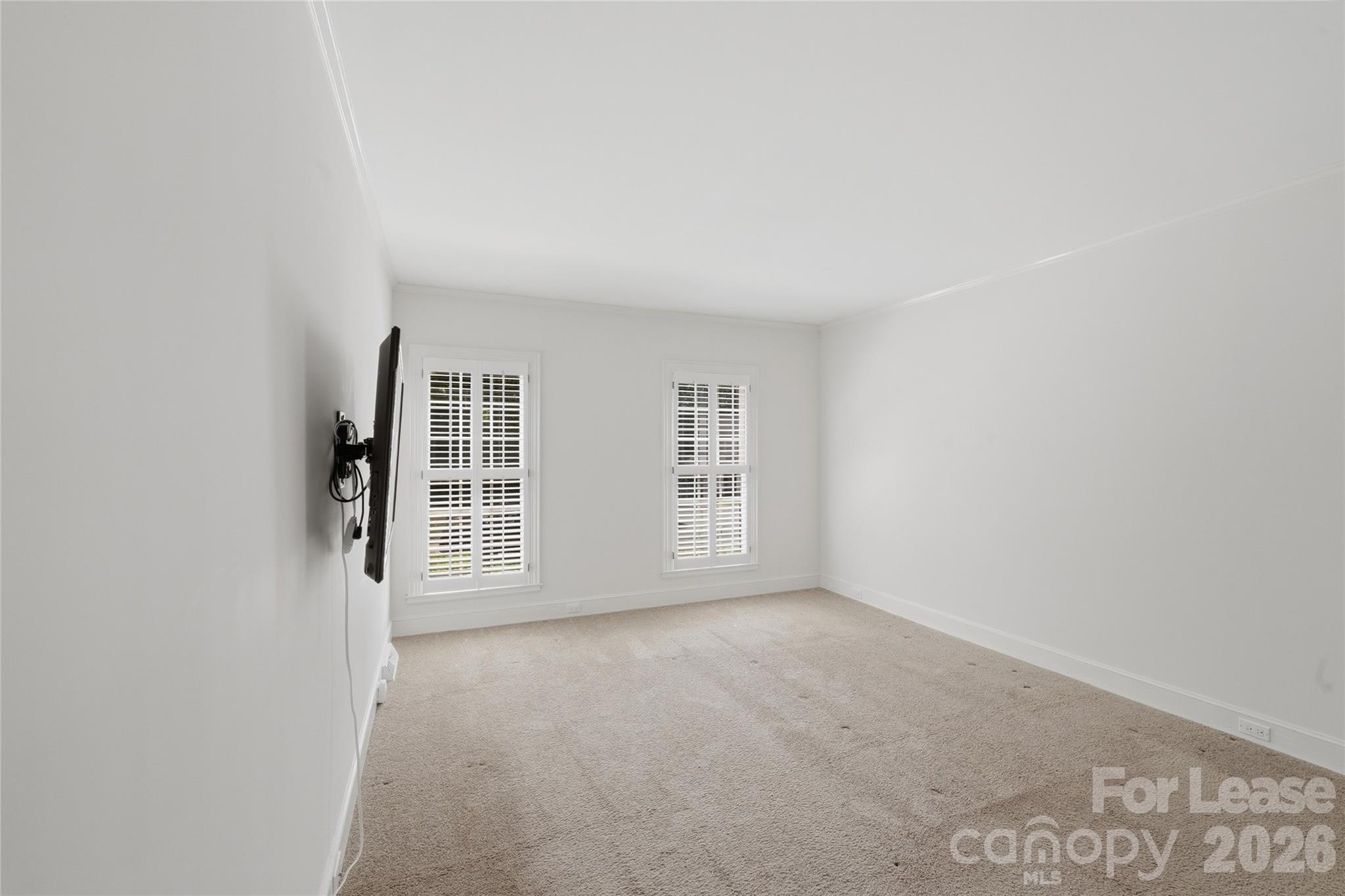 5906 Sharon Hills Road Charlotte, NC 28210 - Photo 18 of 30 a view of a livingroom with an empty space and a window