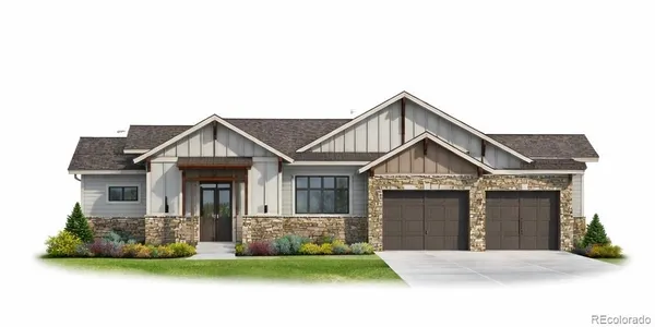 a front view of a house with a garden and yard
