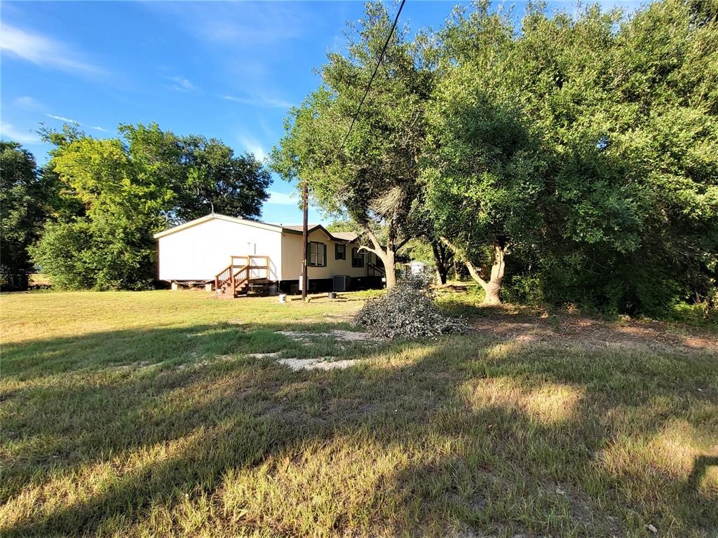 14536 Cochran Road Waller, TX 77484 - Photo 2 of 14 a view of a house with a yard