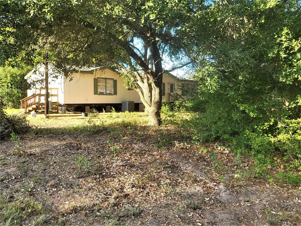 14536 Cochran Road Waller, TX 77484 - Photo 3 of 14 a house view with a tree