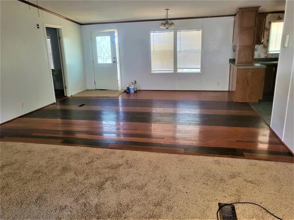 14536 Cochran Road Waller, TX 77484 - Photo 5 of 14 a view of empty room with window and wooden floor