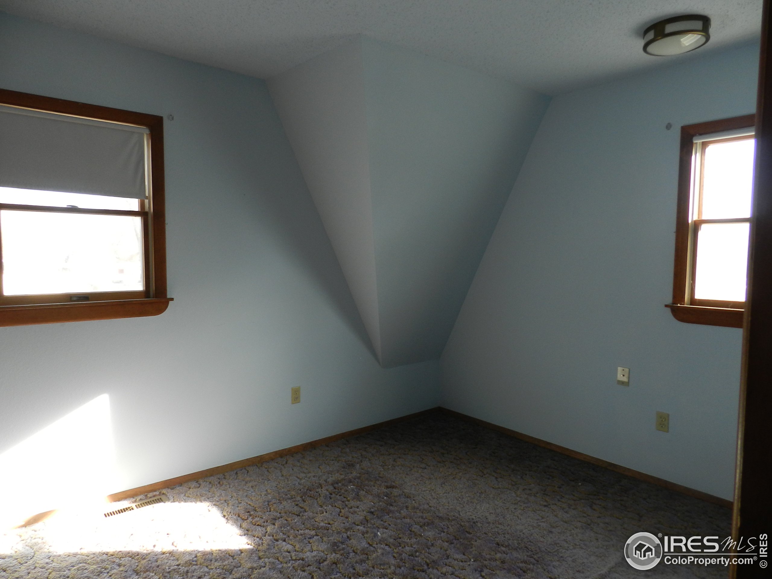 827 Prospect Street Fort Morgan, CO 80701 - Photo 11 of 19 an empty room with a window