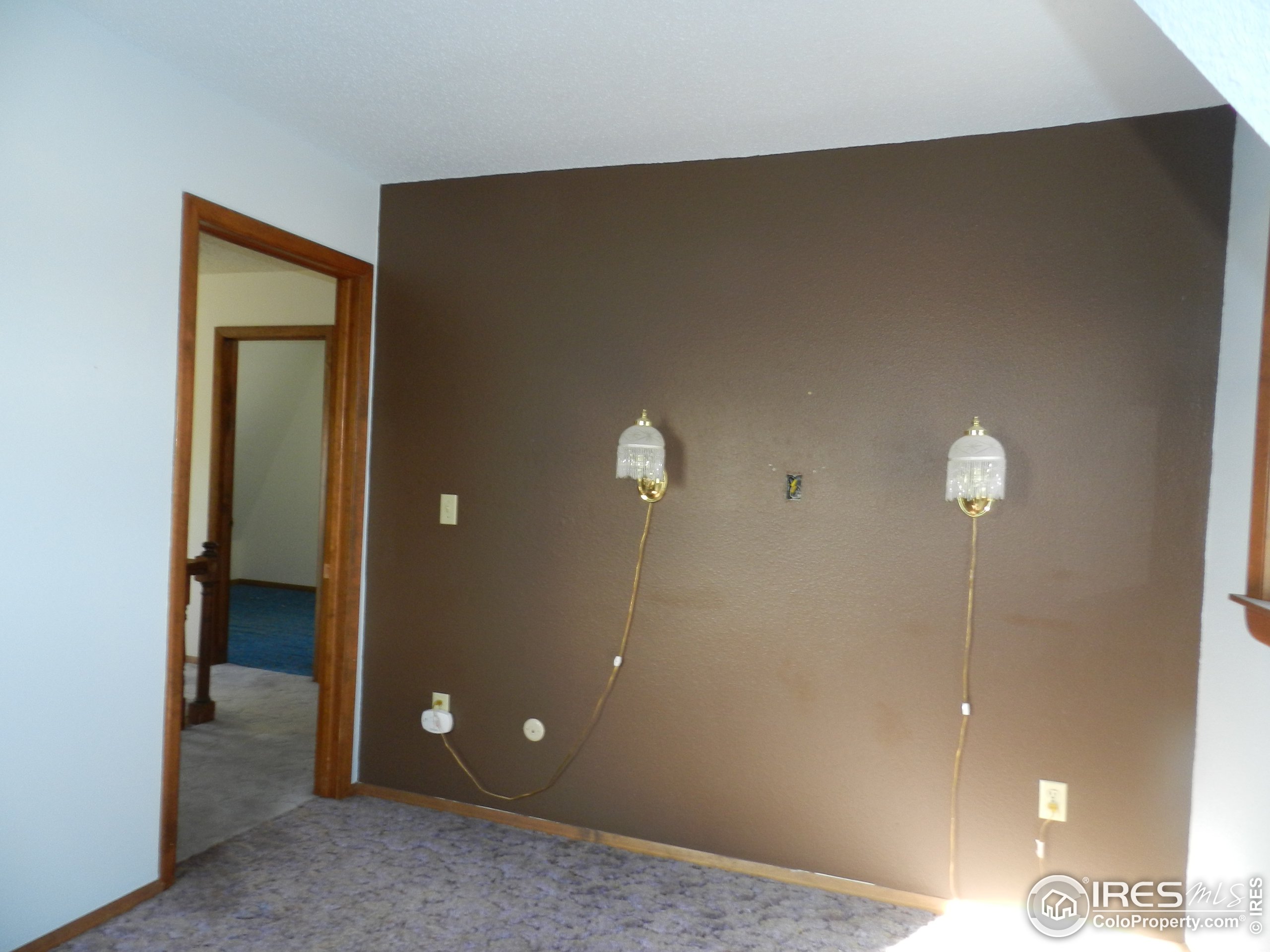 827 Prospect Street Fort Morgan, CO 80701 - Photo 12 of 19 a view of a room with a wardrobe space