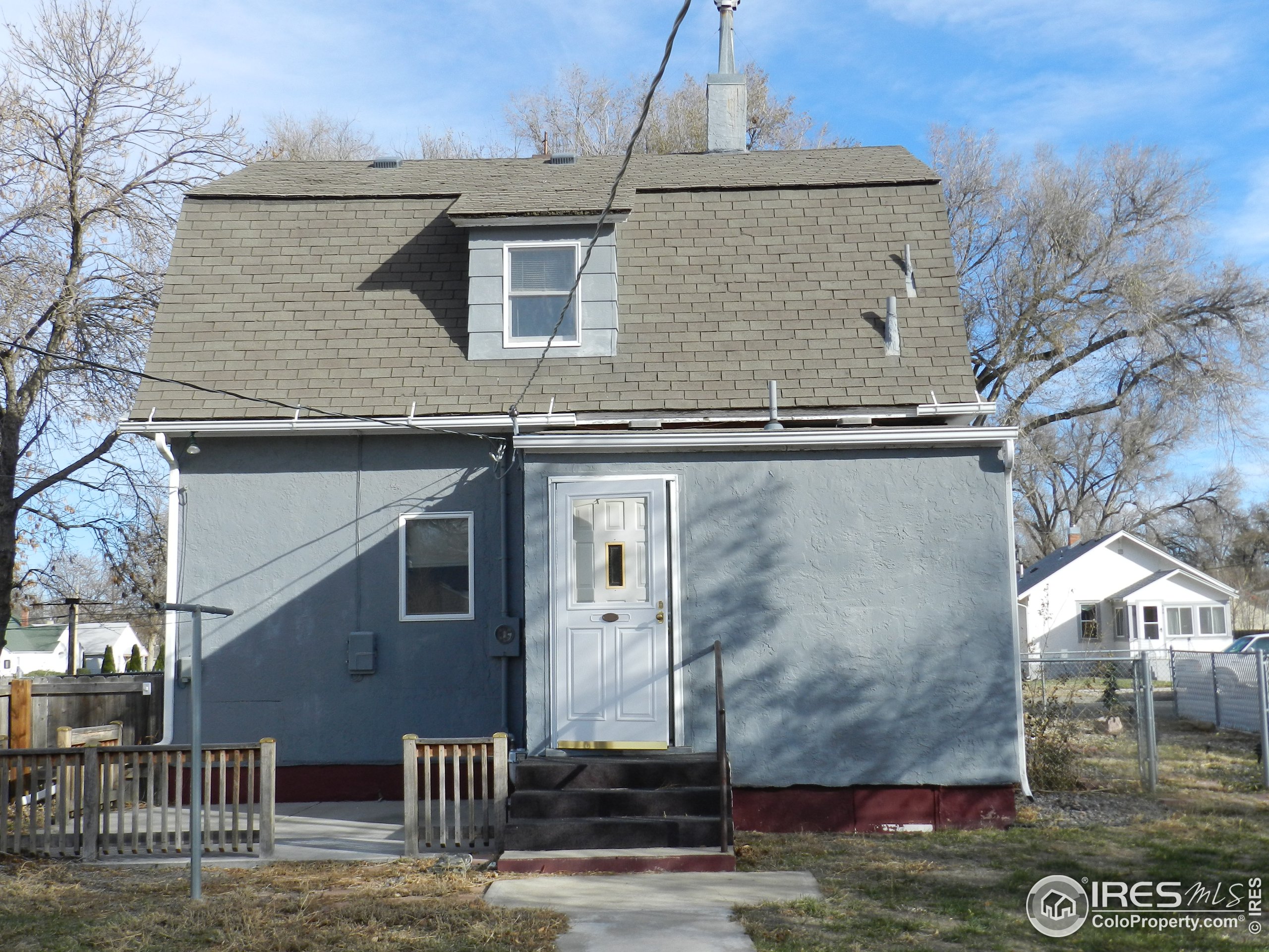 827 Prospect Street Fort Morgan, CO 80701 - Photo 19 of 19 a front view of a house with garden