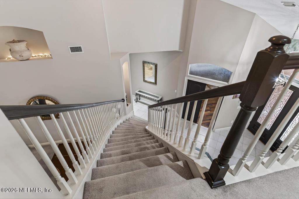 1483 Bridgette Way Fleming Island, FL 32003 - Photo 50 of 63 a view of a hallway with staircase